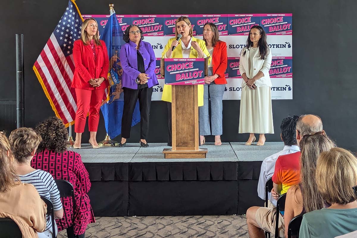 Elissa Slotkin on a stage, speaking to supporters 