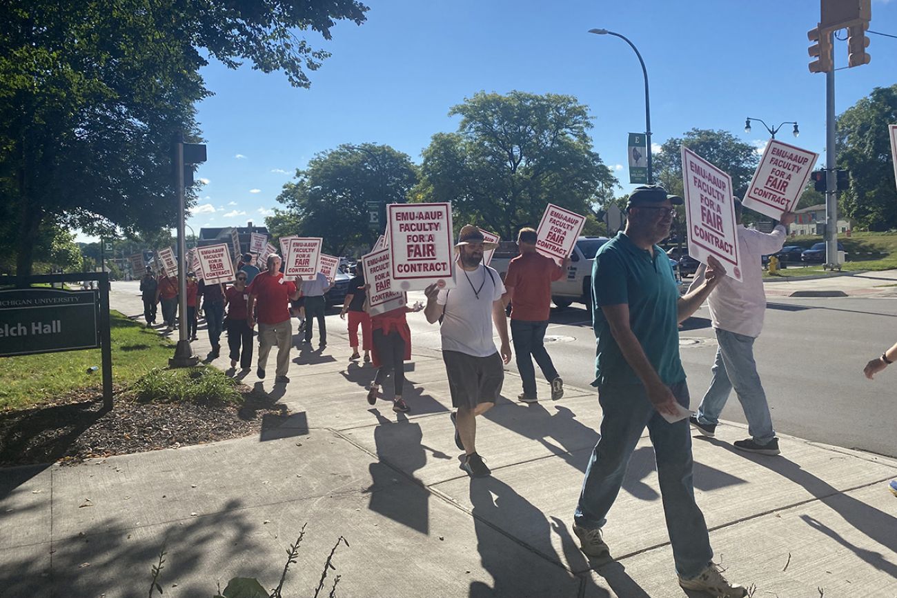 people marching on Eastern Michigan University's campus