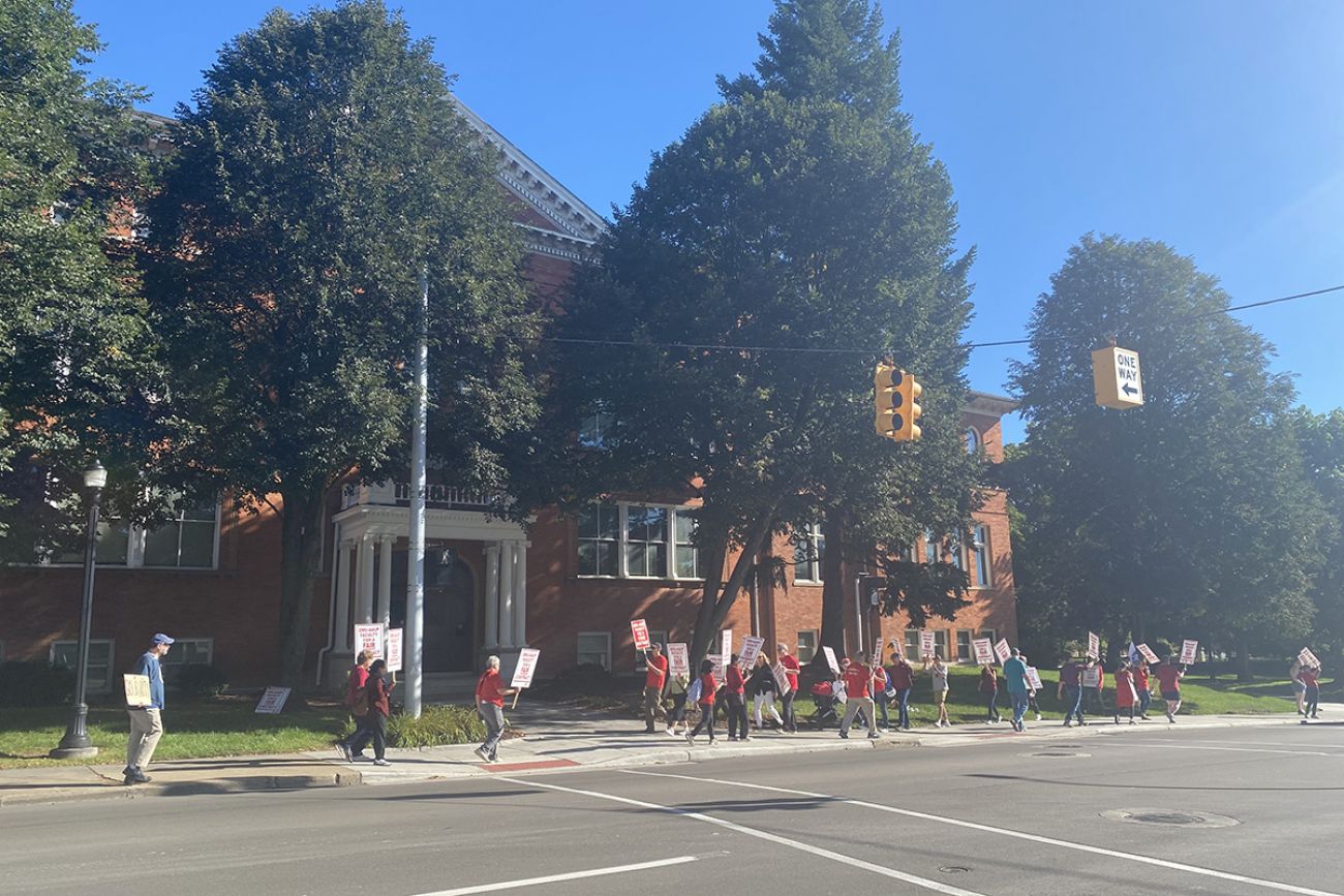 people marching on EMU's campus