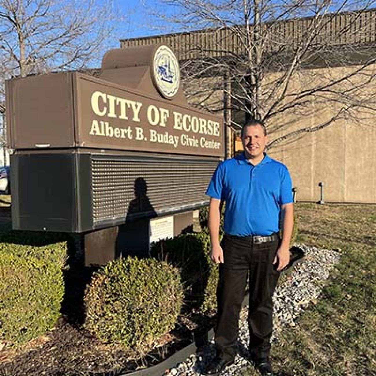 man standing in front of building