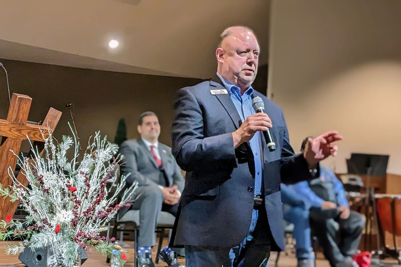 Scott Greenlee speaking in a microphone