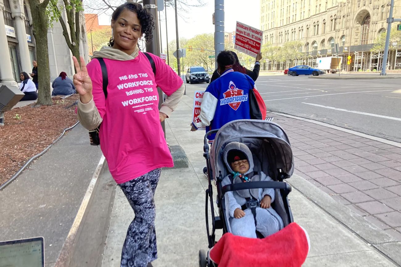 woman with two children posing for picture in Detroit