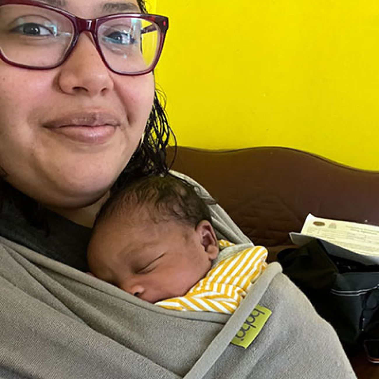 woman cuddling with baby