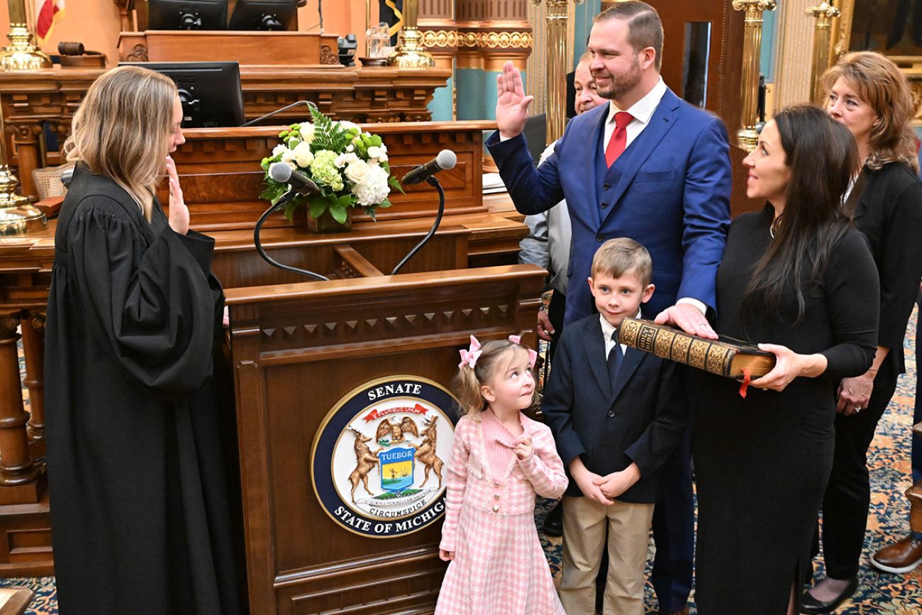 Jonathan Lindsdey being surrounded by family