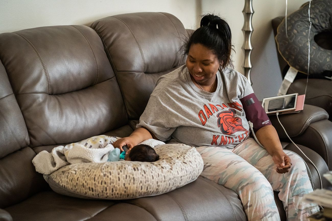 mom on the couch with her baby