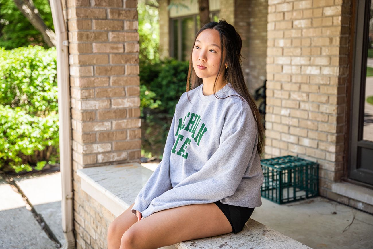 Sophia Yee sitting on porch