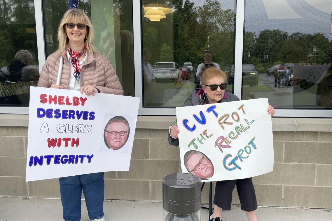 Protestors holding signs