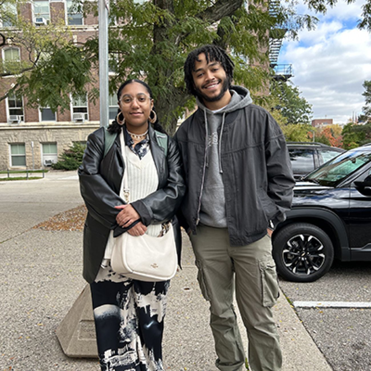 two students standing next to each other