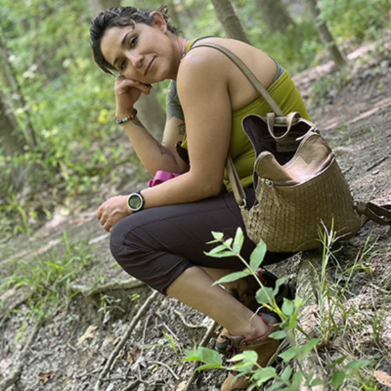 woman sitting in the woods