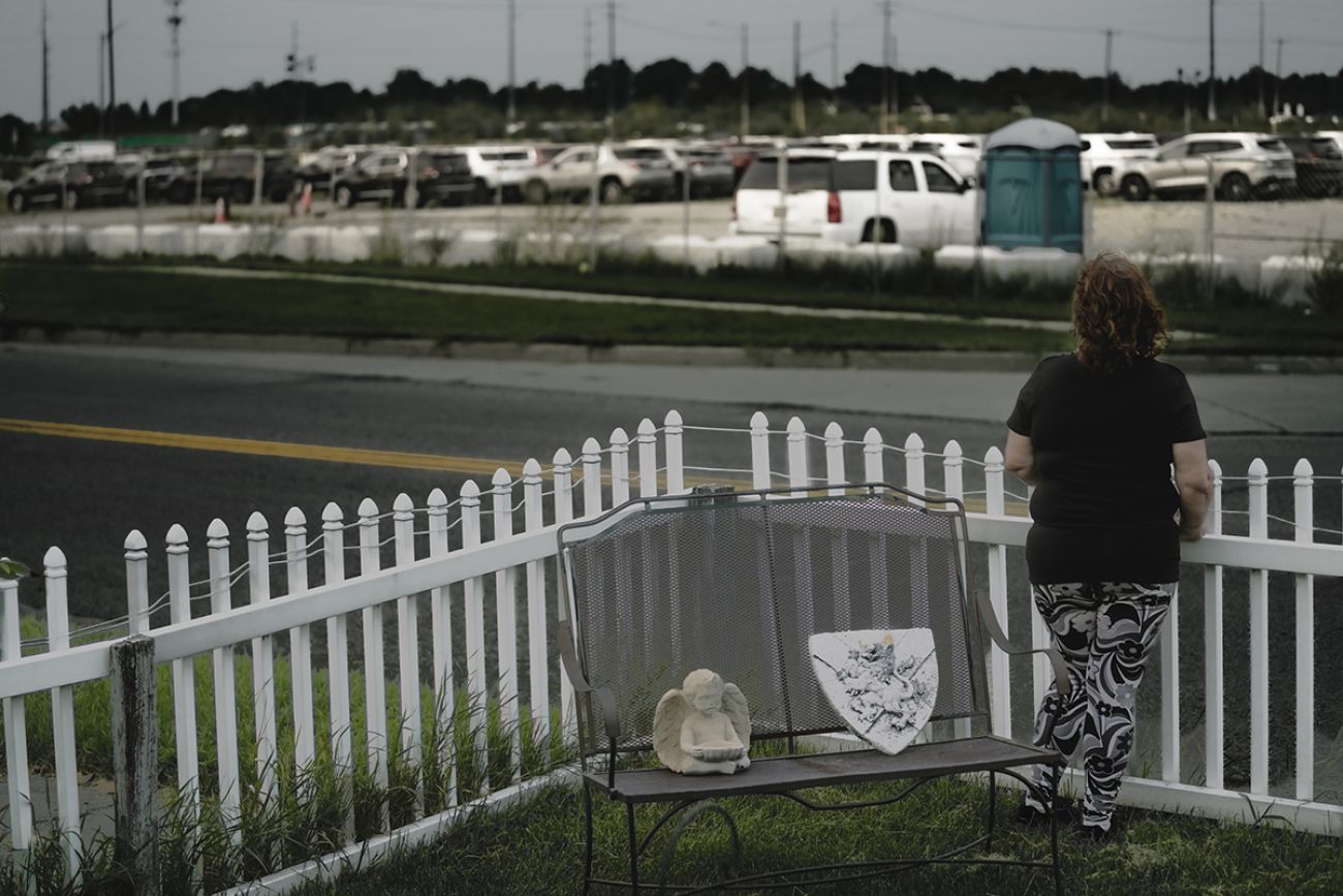 woman looking outside the fence