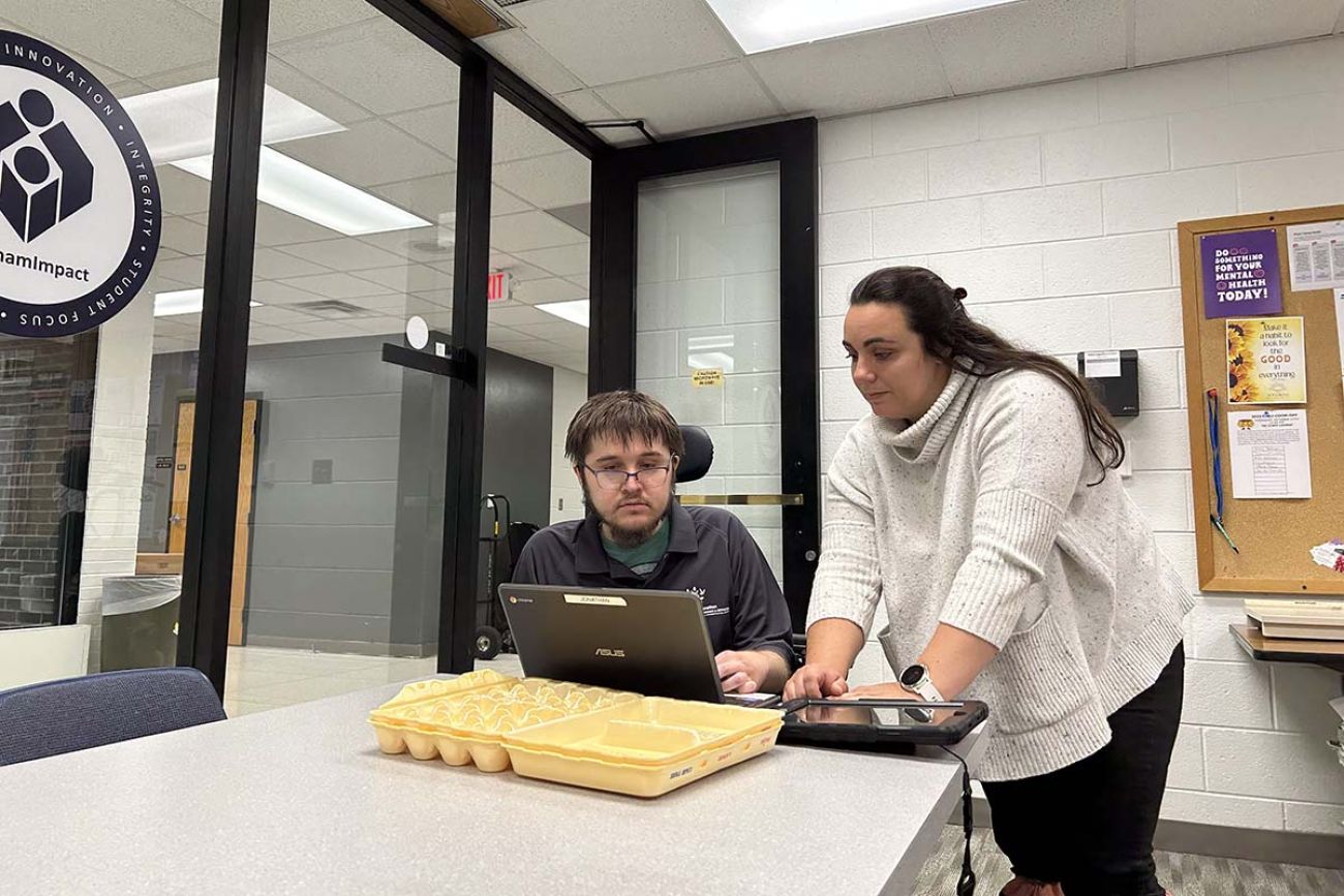 Emma Booth talking to a student