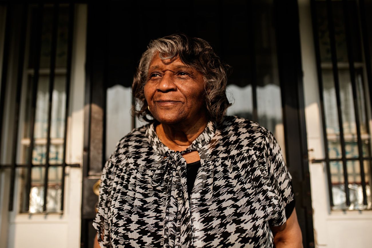 Erma Barnes standing in front of a door