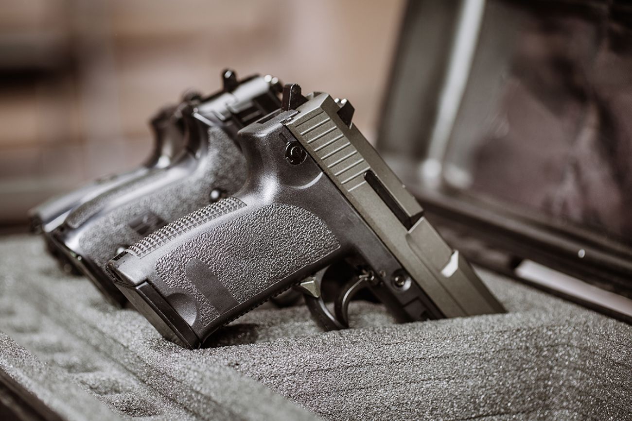 black handgun in plastic Secure Storage Case