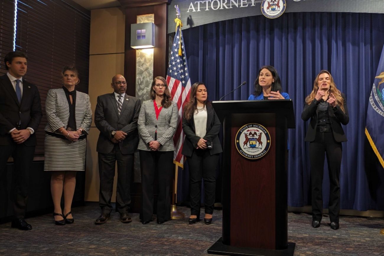 Dana Nessel stands at a podium