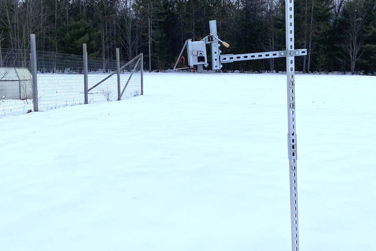 monitor sticking out the snow-covered ground