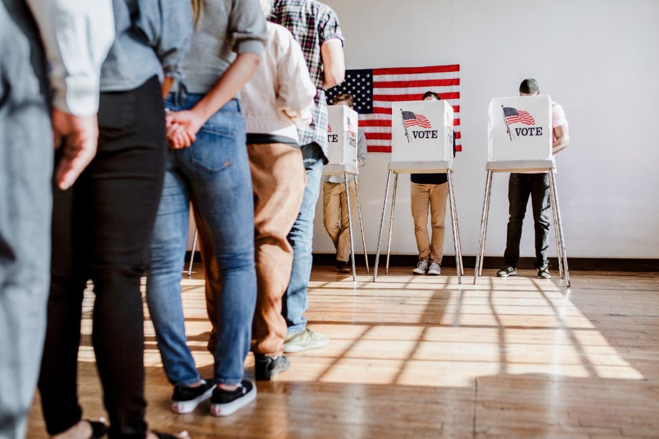 People standing at a polling booth