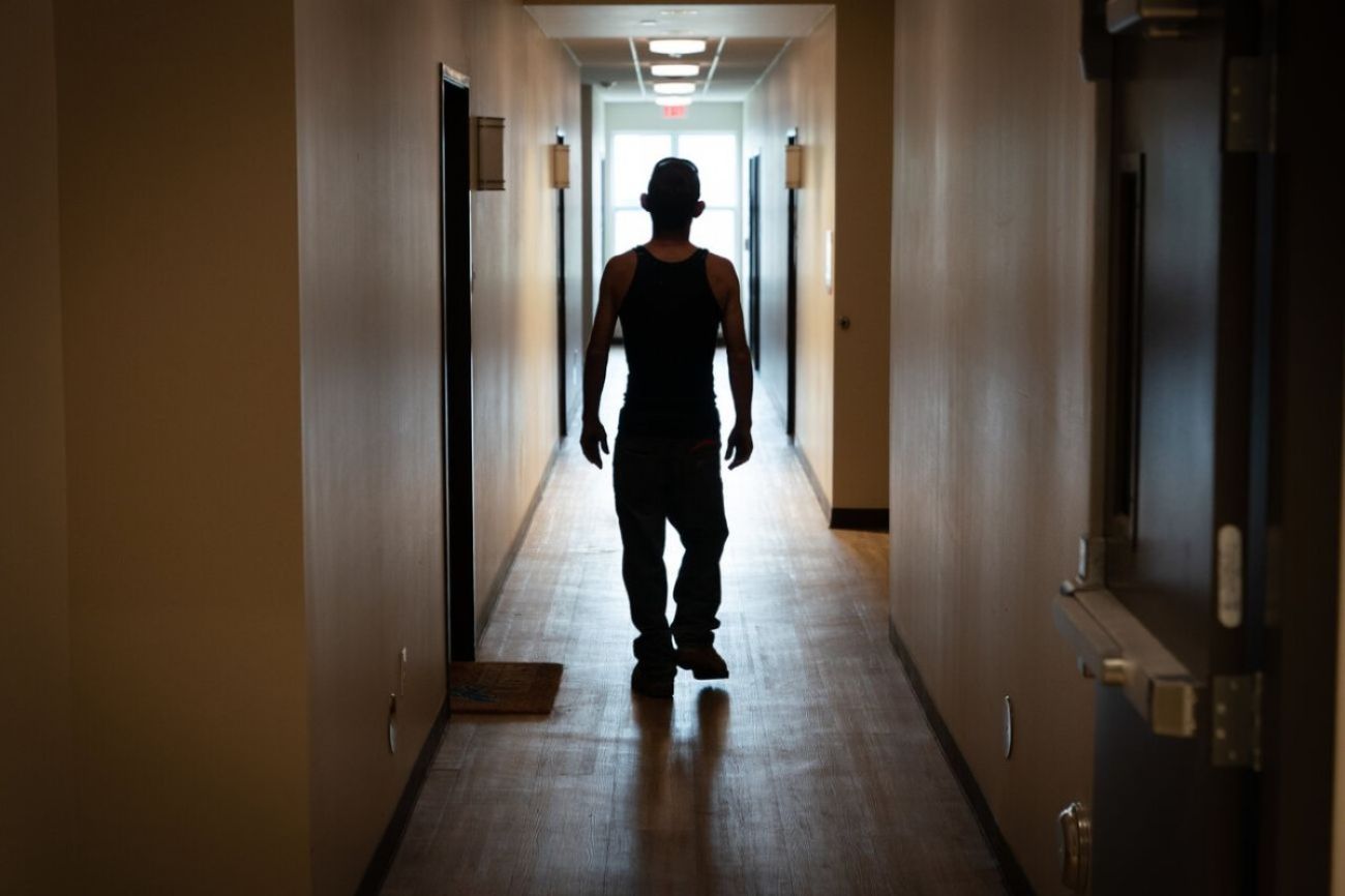 Man stands in hallway