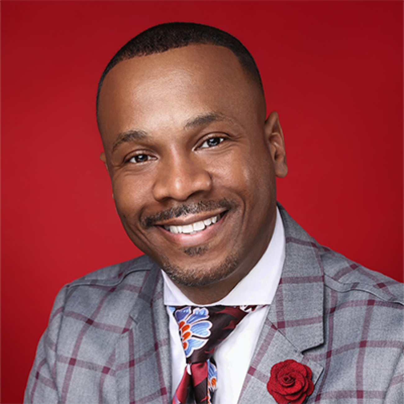 Rev. Richard R. White III wearing a colorful suit and tie