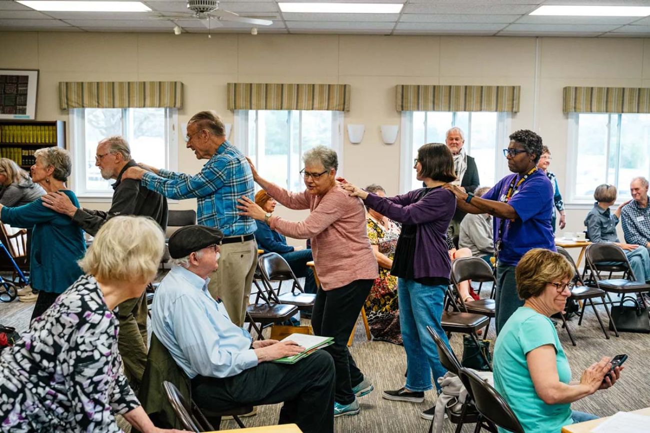 An bunch of elderly people in a room