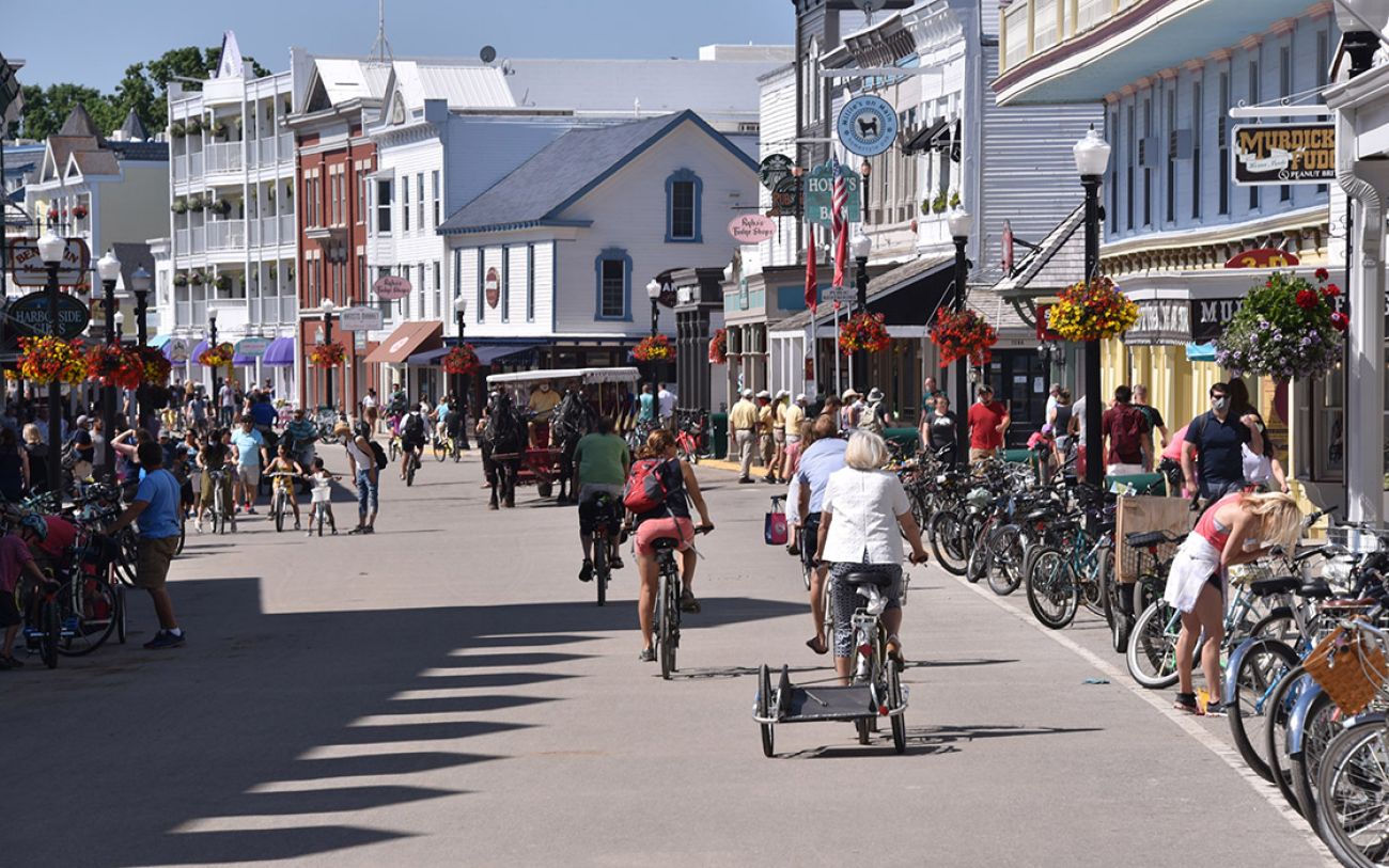 A lot of people on the main street of Mackinac Island. You can see people riding bikes