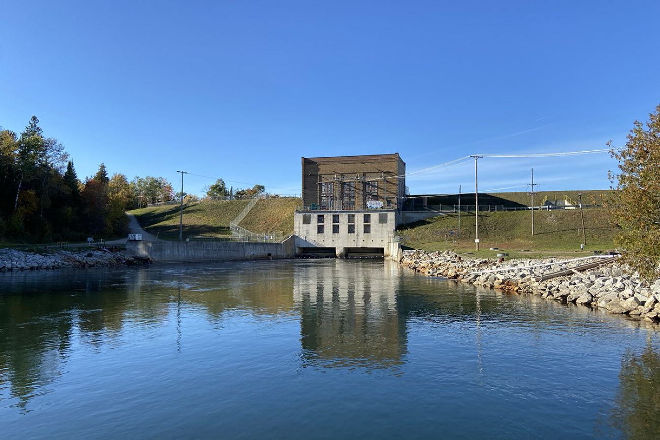 Alcona Dam on the Au Sable River on a sunny day