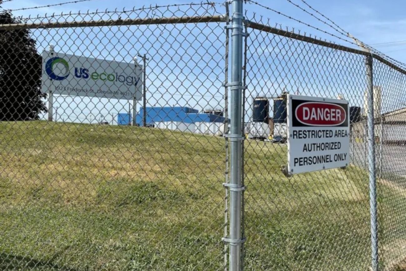  US Ecology sign behind a high fence