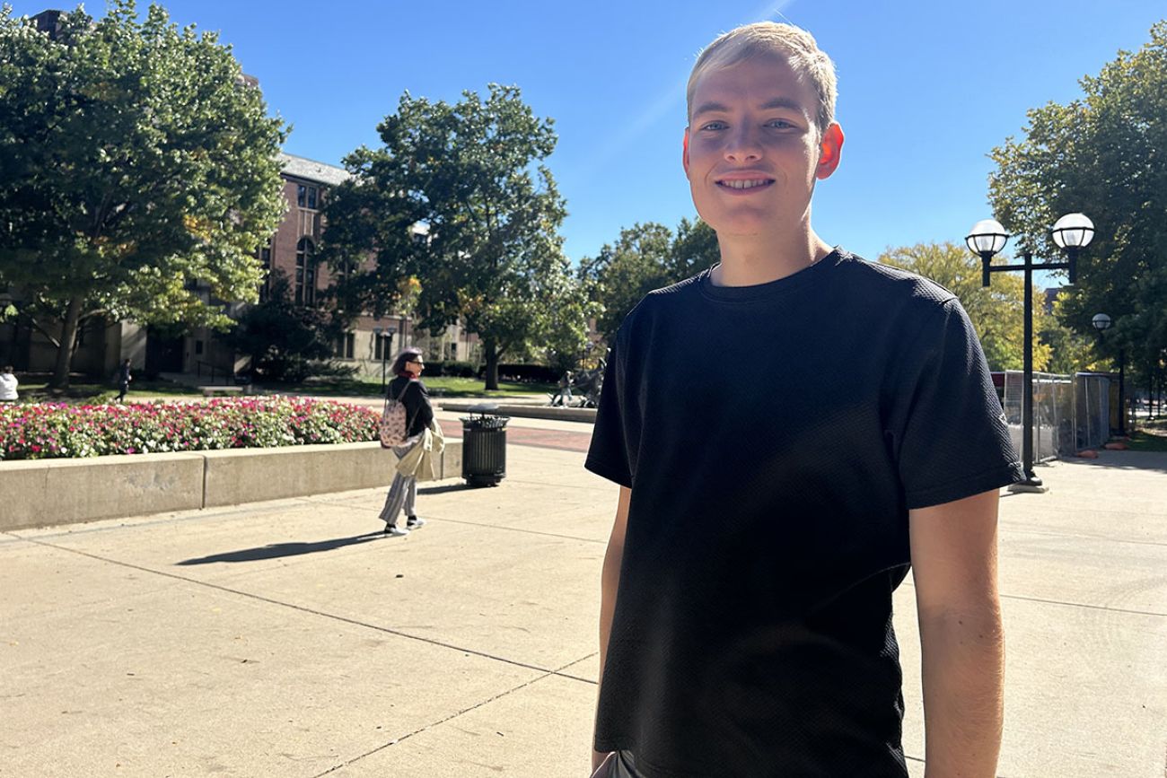 Max Scheske, wearing a black t-shirt, poses for a picture