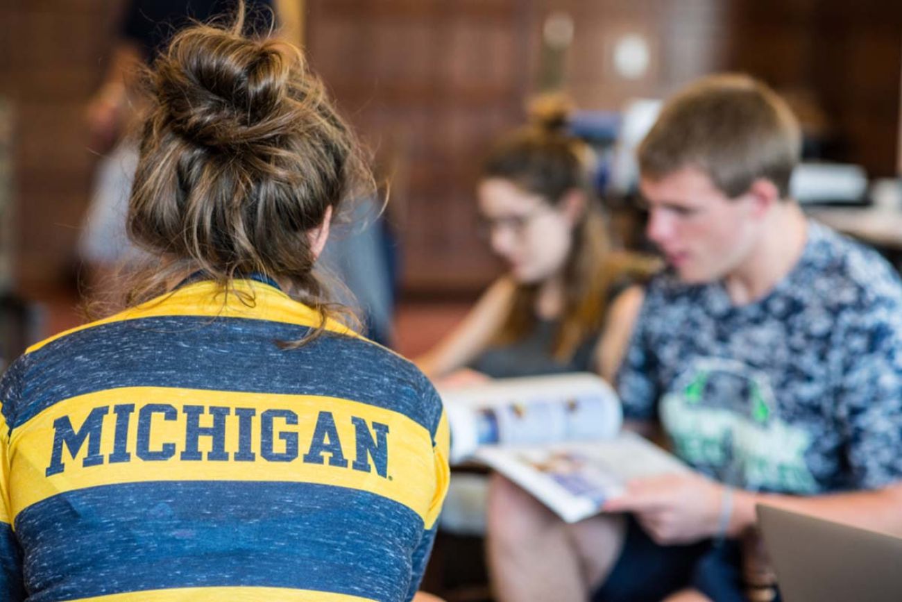 College students. One of the students is wearing a University of Michigan shirt