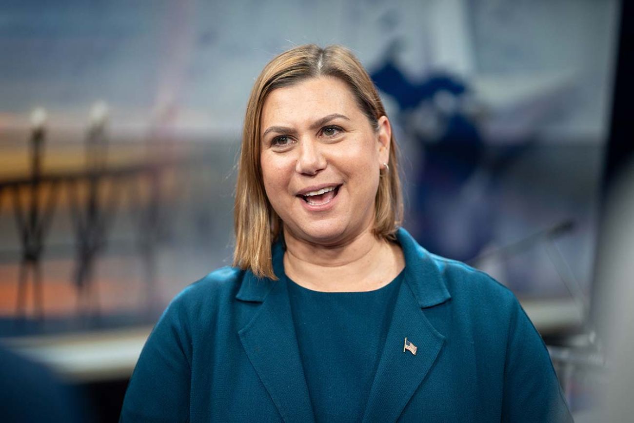 Elissa Slotkin, wearing a blue top, smiles at the camera