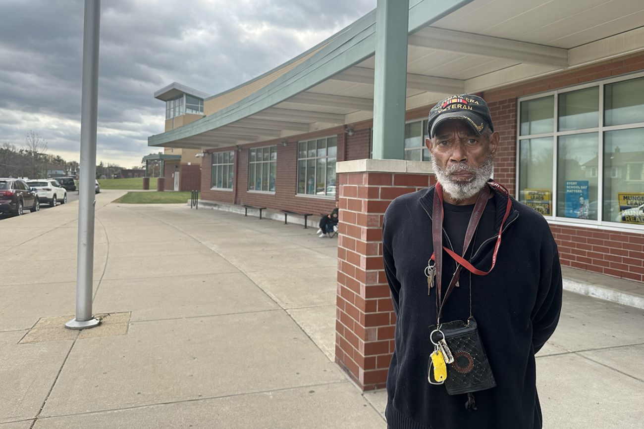 A photo of Cedric Henry posing for a photo outside