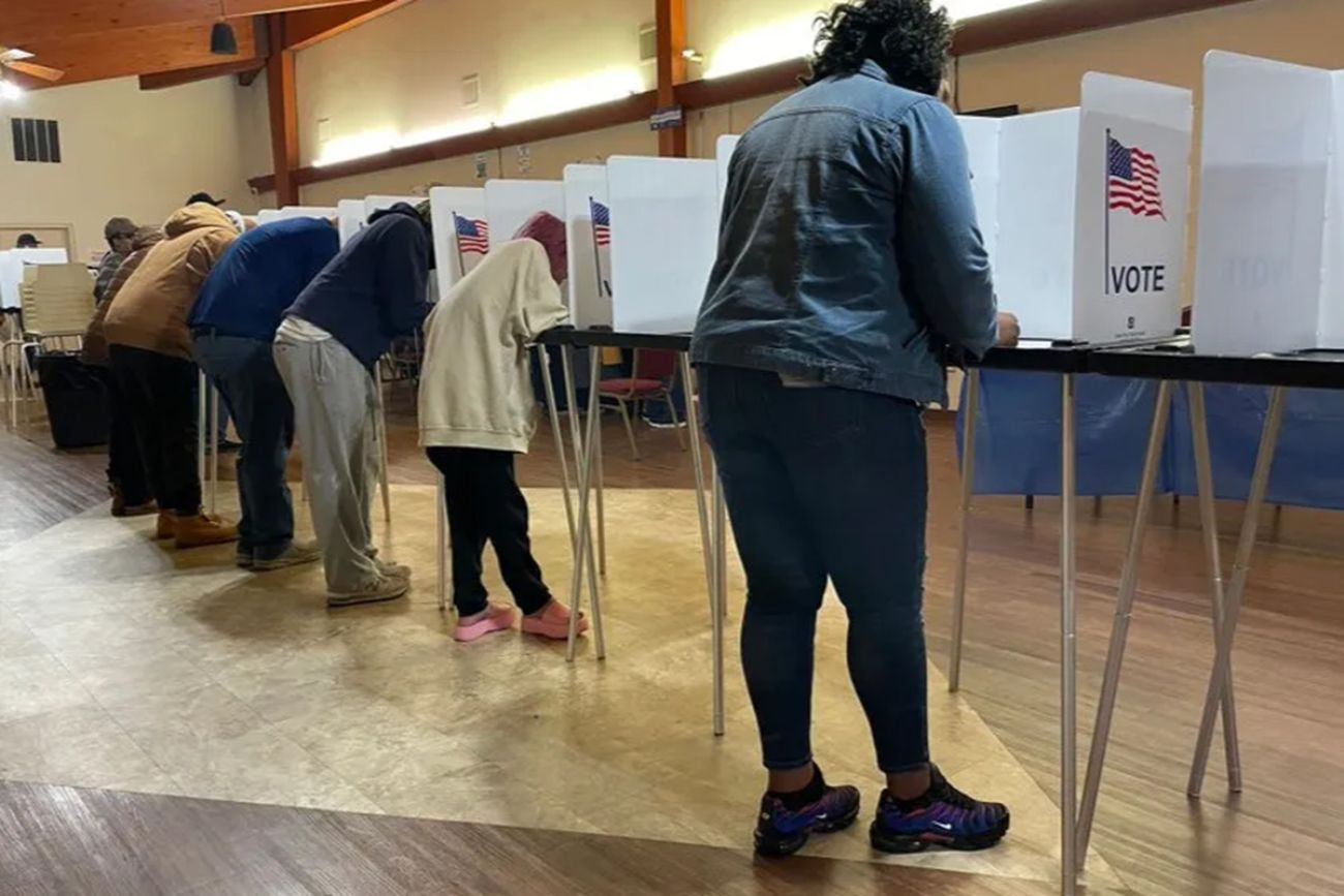 People voting at booths in Detroit 