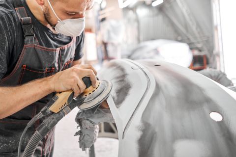 man working on a car