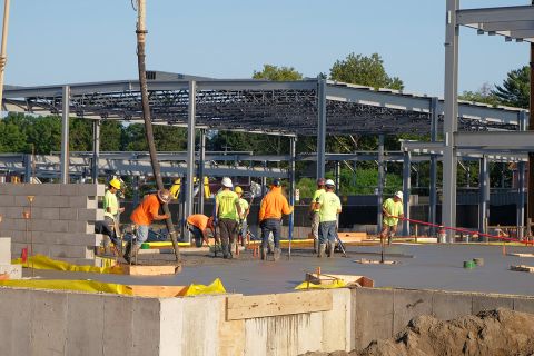 Team of Concrete Workers executing concrete pour