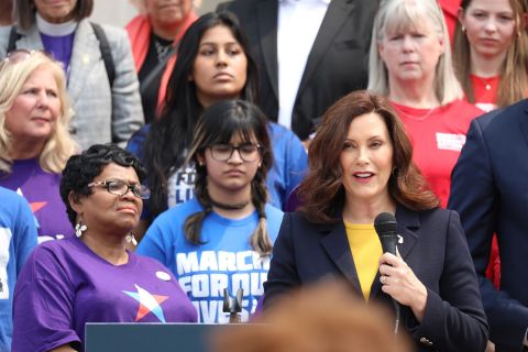 Gov. Gretchen Whitmer speaking into a microphone