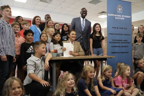 Gov. Gretchen Whitmer surrounded by children