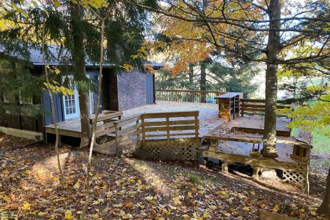 a home with a large deck surrounded by deck 