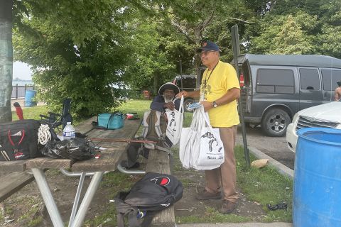 Jim Bridgforth holding bags