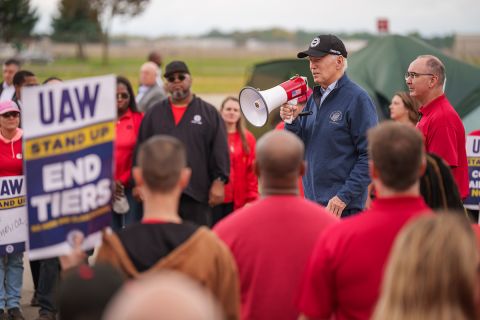 President Joe Biden speaks into a bullhorn