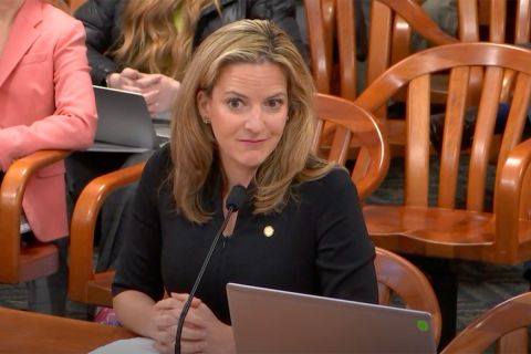 Michigan Secretary of State Jocelyn Benson siting at a table