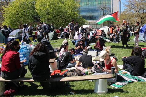 A group of Michigan State University students and community members outside