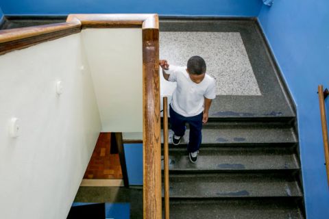 A boy walking down the stairs