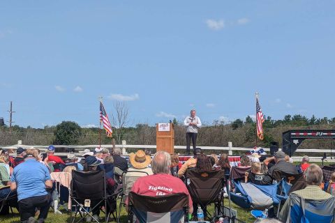 Republican U.S. Senate candidate Mike Rogers on the stage, talking to a crowd