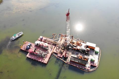 Aerial shot of oil rig in water