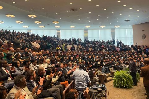 Detroit Mayor Mike Duggan speaking into a crowded room