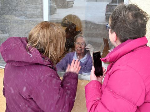 Stacy Doubrava and Sarah Maynard visit their mother Mary Jane Schoendorf at the Ovid Healthcare Center