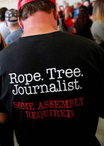 The back of a t-shirt saying "Rope. Tree. Journalist. Some Assembly Required."