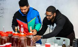 two men making beer