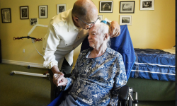 man kissing woman in a wheelchair