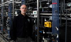 Brian Steglitz standing in front of pipes