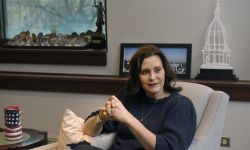 Gov. Gretchen Whitmer sitting in a chair